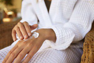Woman Applying Hand Lotion