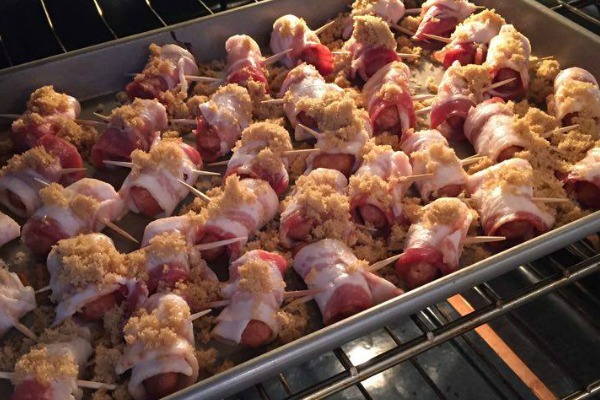These little smokies wrapped in bacon are simply amazing! You'll never guess what the secret ingredient is! https://couponcravings.com/bacon-wrapped-candied-lil-smokies/