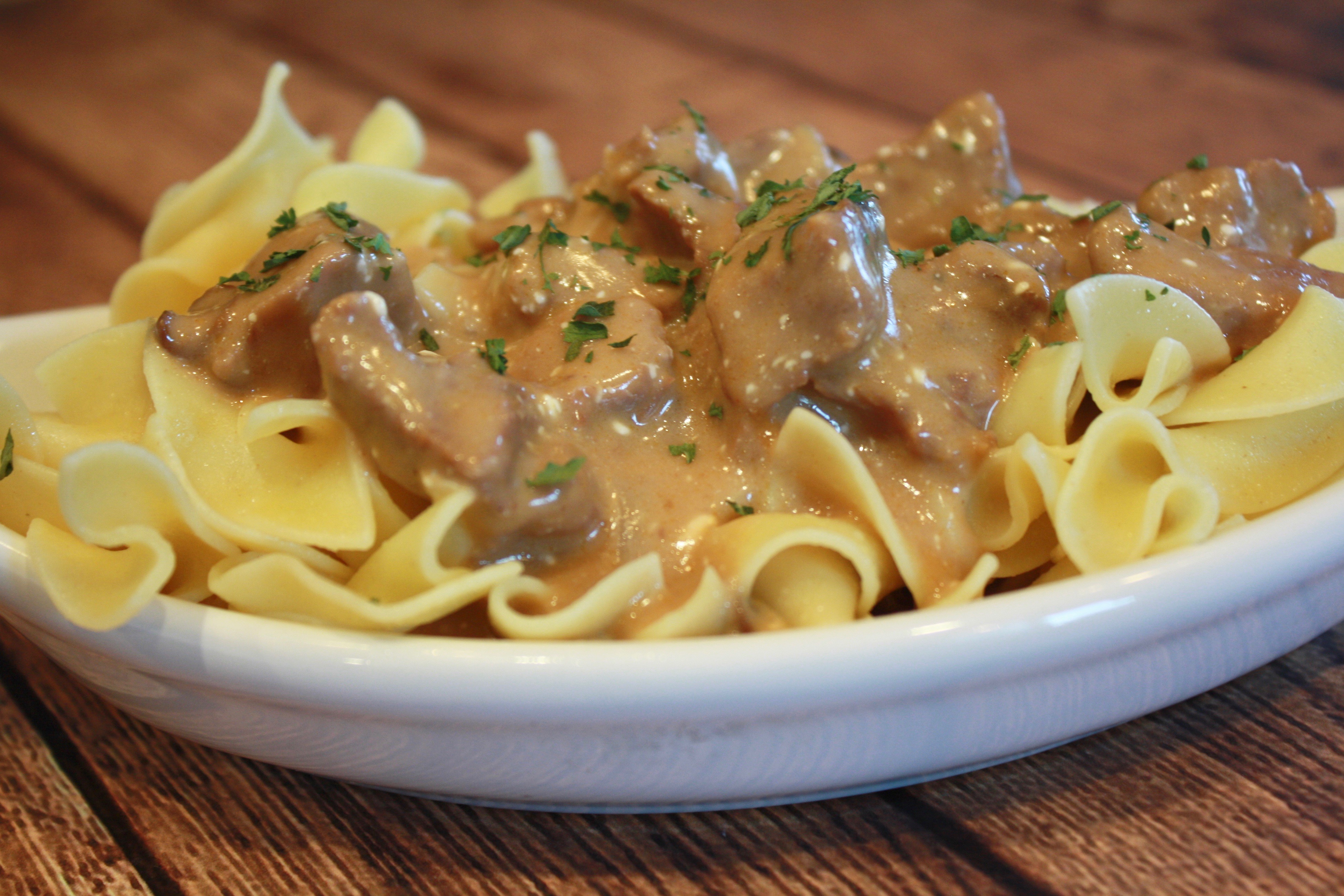 Slow Cooker Beef Stroganoff ~ An easy crock pot meal featuring tender beef and hearty mushrooms in a sour cream sauce. This is an easy weeknight meal to serve too, as most of the cooking is done while you are away. The best kind of weeknight dinner recipes!