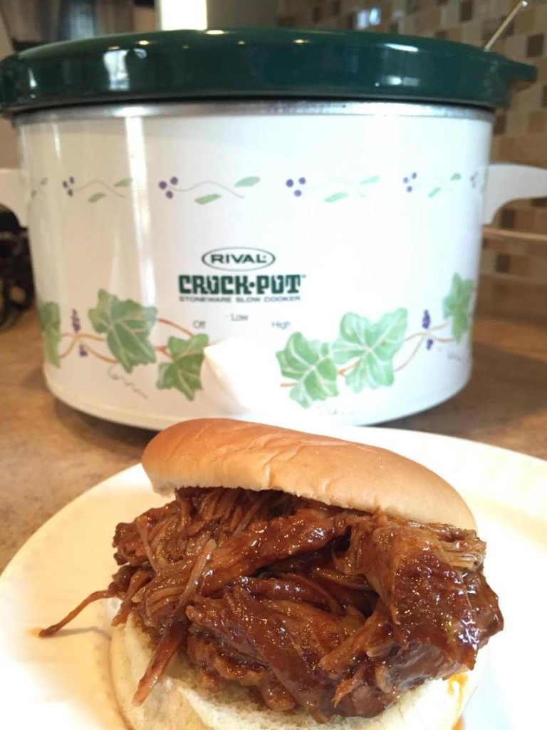 barbeque slow cooker pulled pork sandwich ready to be eaten