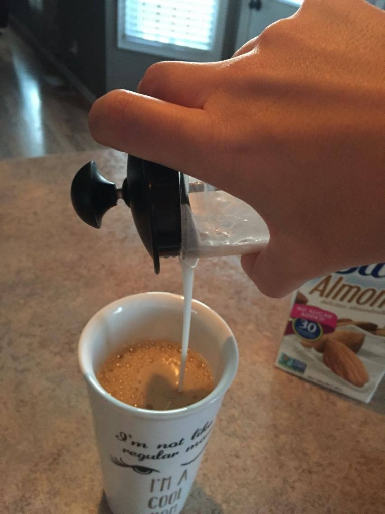 adding my frothed milk from my milk frother