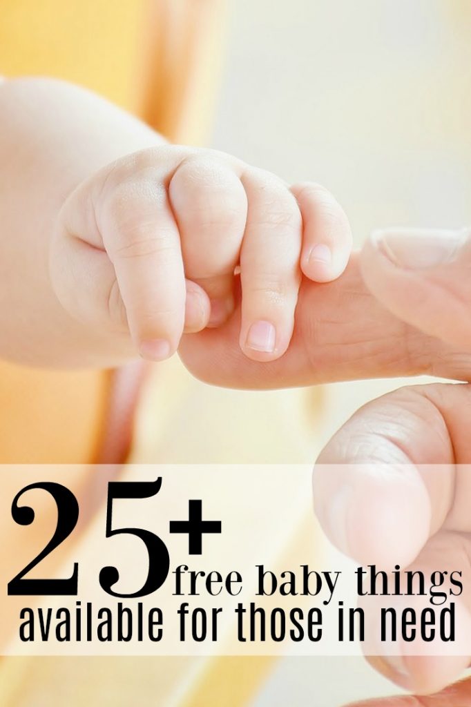 A baby and dad's hand interlocking