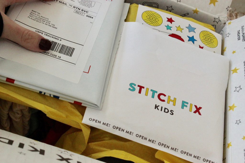 Upon opening the kids Stitch Fix box there is a receipt and a bag to send back kids clothes with free shipping