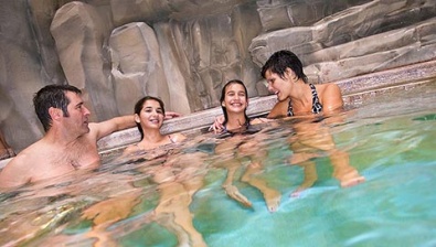 Adults enjoying the hot tub at the Great Wolf Lodge KS location