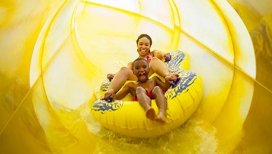 Mom and child on the water slide at the Great Wolf Lodge Kansas location