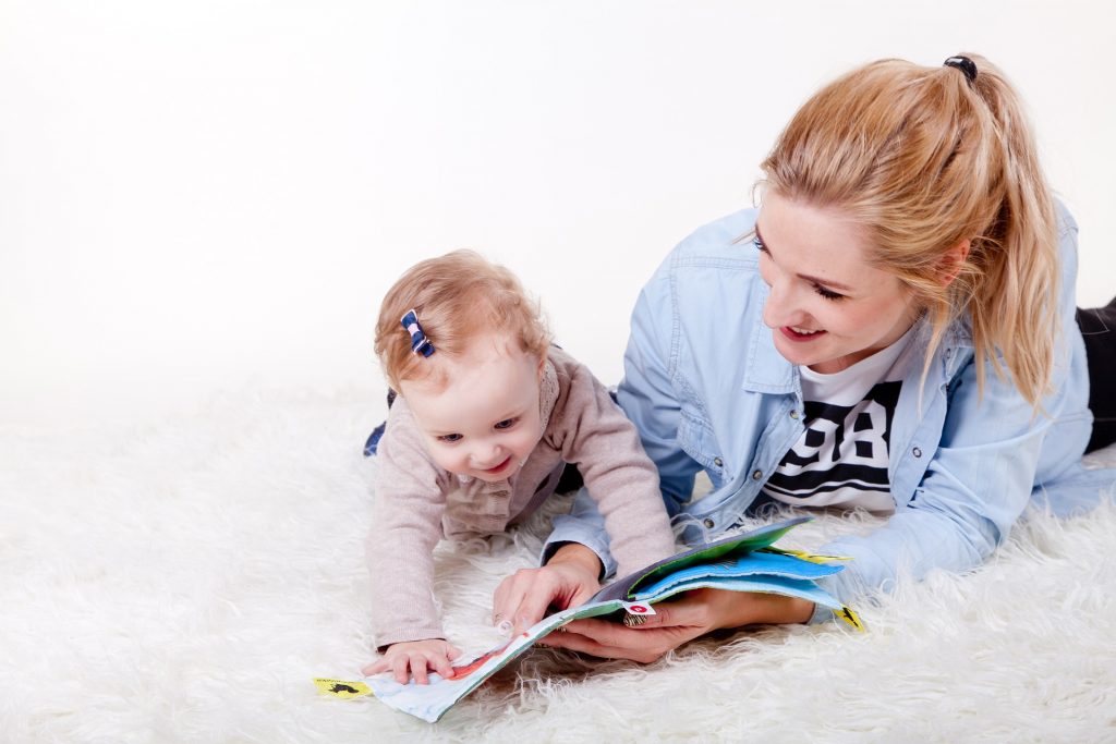 Mom and baby reading a book