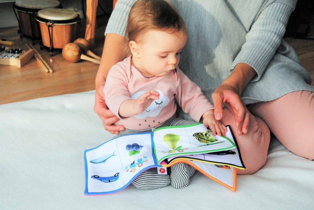mom reading baby a book
