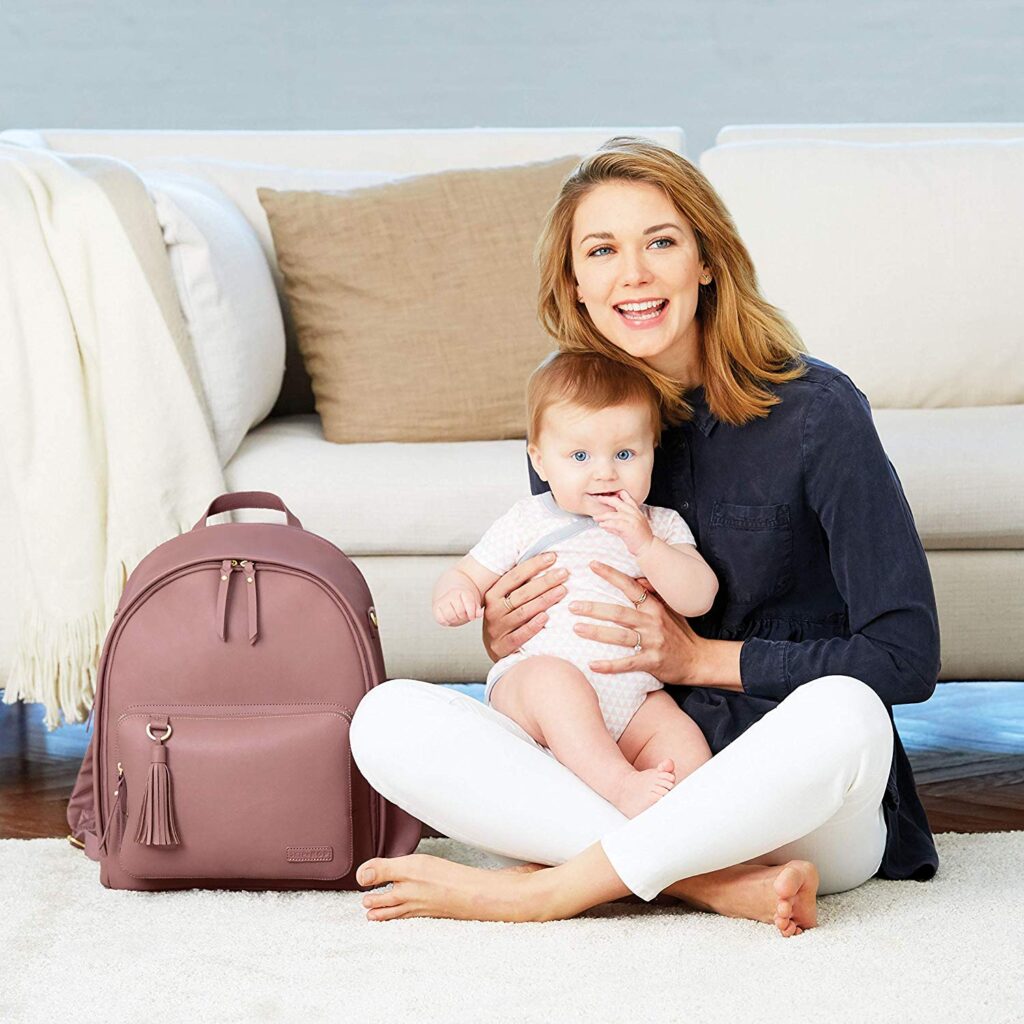mom with baby and diaper bag backpack