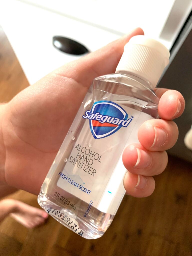 sanitizer in nine year olds hand