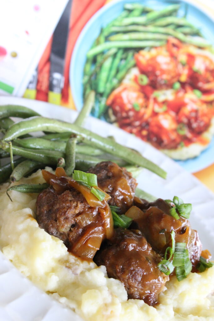 finished hello fresh dinner of gravy covered meatballs, mashed potatoes and green beans