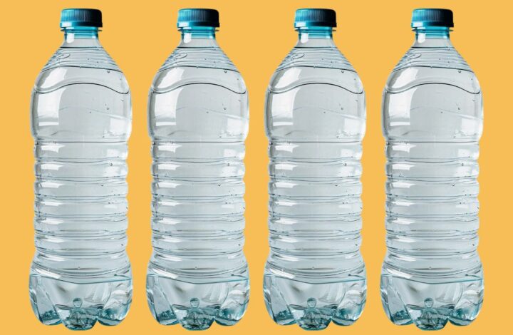 Four water bottles on a yellow background signifying how to help people drink more water